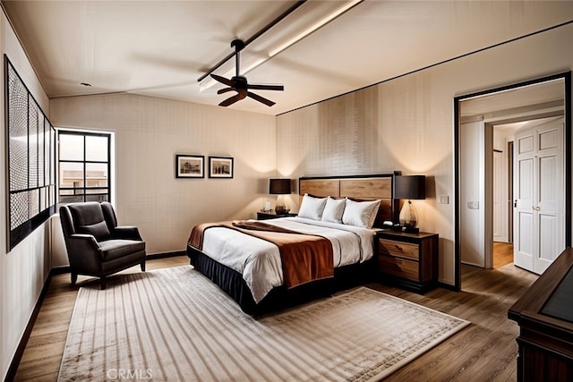 bedroom with dark wood-type flooring and ceiling fan