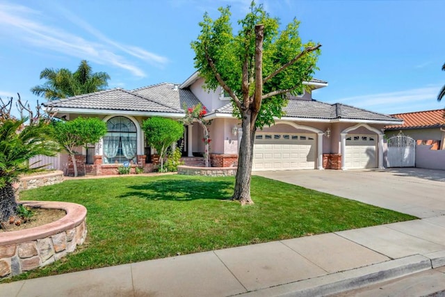 view of front of home featuring a garage and a front lawn