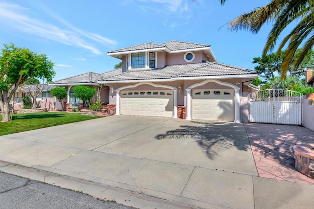 view of front facade featuring a garage and a front lawn