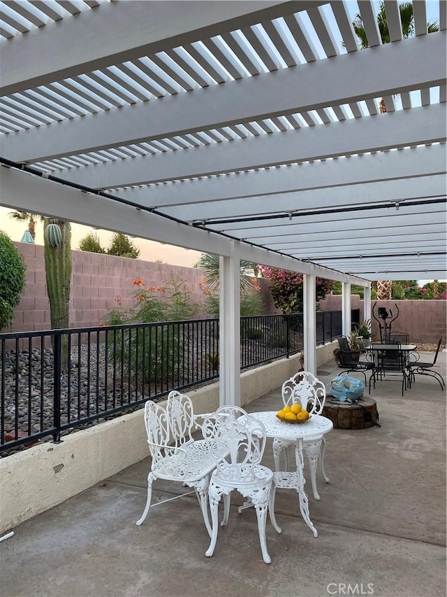 patio terrace at dusk with a pergola