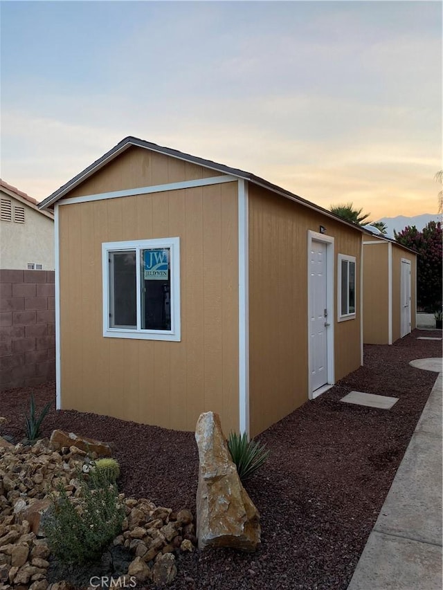 view of property exterior at dusk