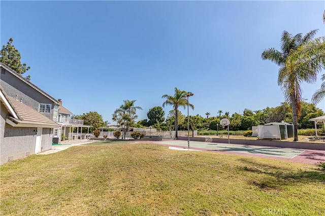 view of yard featuring basketball court