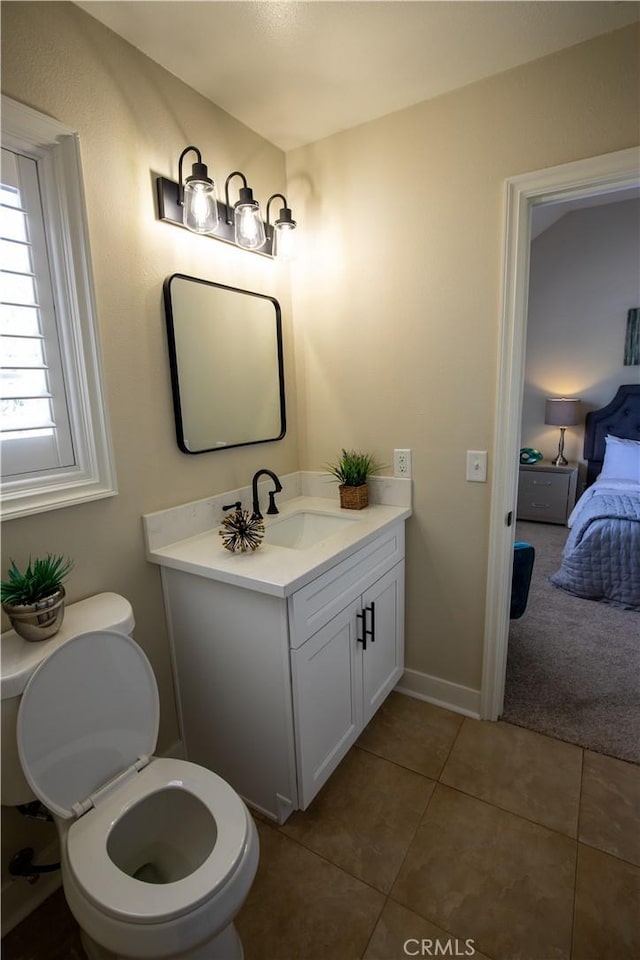 bathroom with tile patterned flooring and vanity