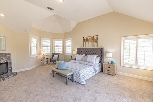 carpeted bedroom featuring lofted ceiling