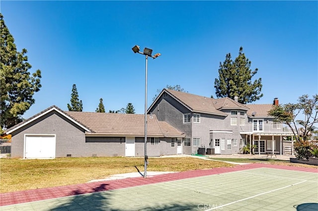 view of basketball court featuring a yard