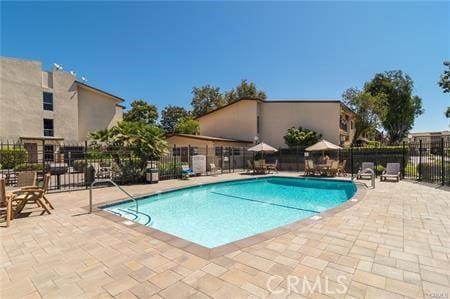 view of swimming pool featuring a patio area