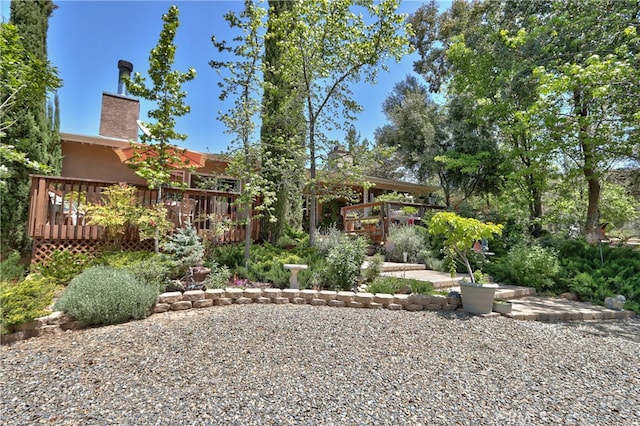 rear view of property with a wooden deck