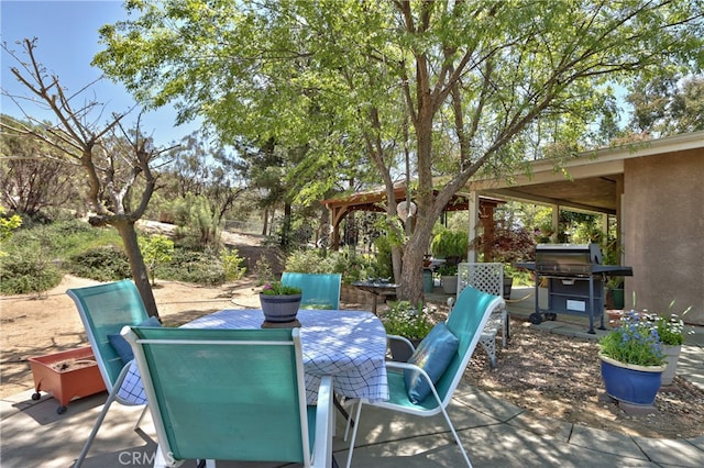 view of patio with a grill