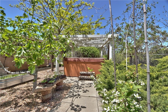 view of yard featuring a pergola and a hot tub