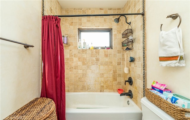 bathroom with shower / tub combo with curtain and toilet