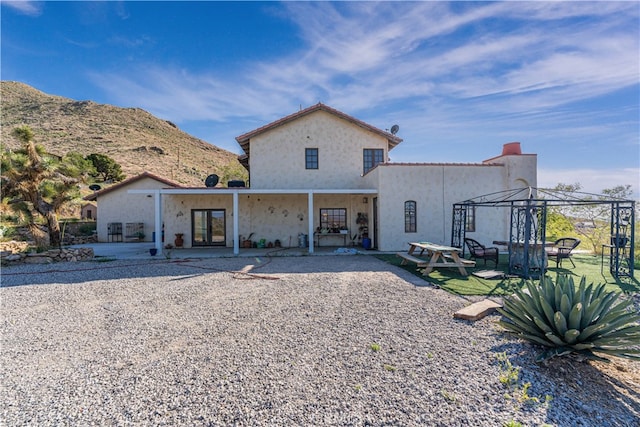 view of front of home with a patio area and a gazebo