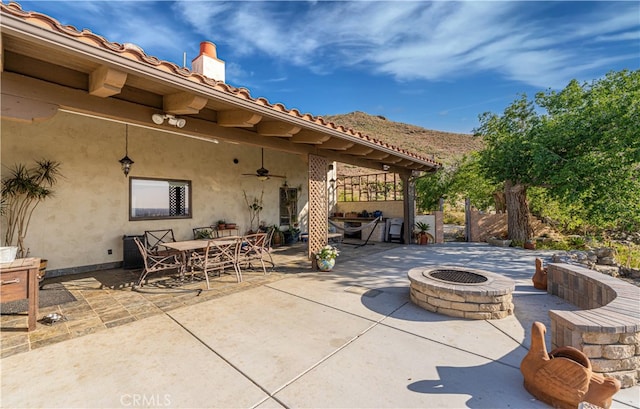 view of patio with an outdoor fire pit