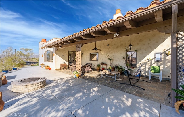 view of patio with a fire pit