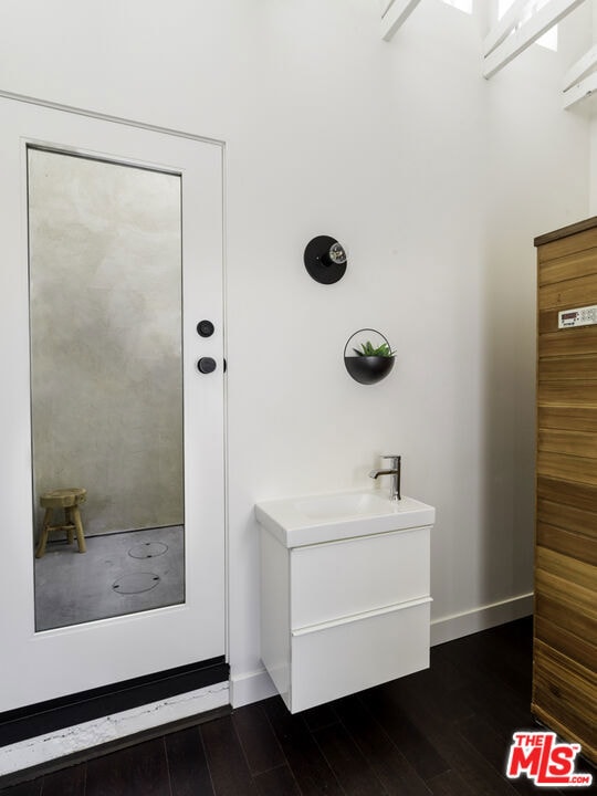 bathroom featuring hardwood / wood-style flooring and vanity