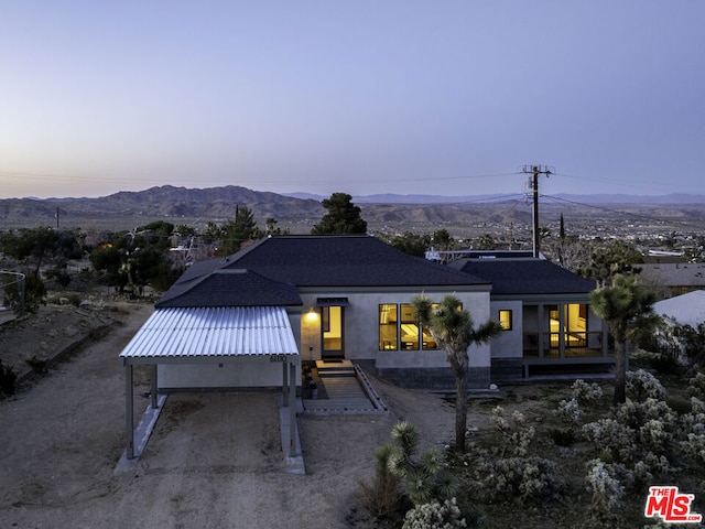 view of front of property with a mountain view