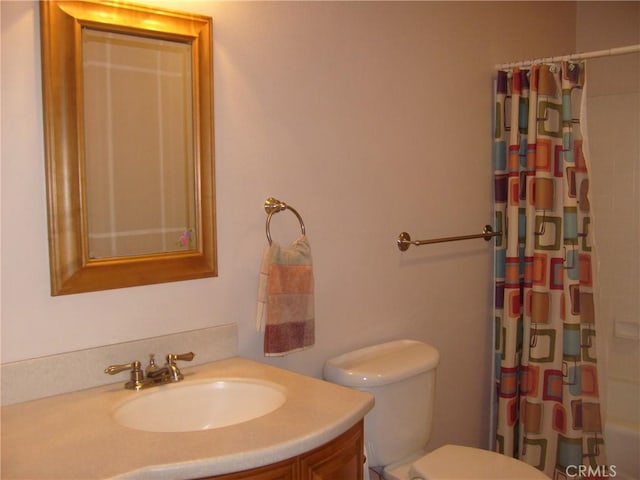 full bathroom with shower / tub combo, vanity, and toilet