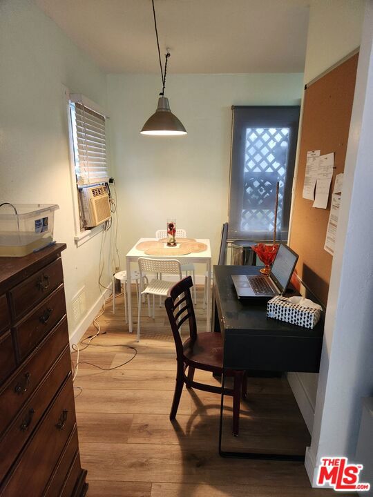 dining space with light hardwood / wood-style floors