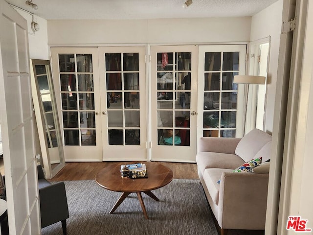 sunroom / solarium featuring french doors