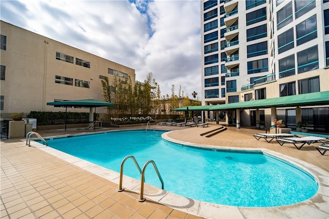 view of swimming pool featuring a patio