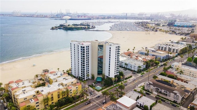 drone / aerial view featuring a view of the beach and a water view