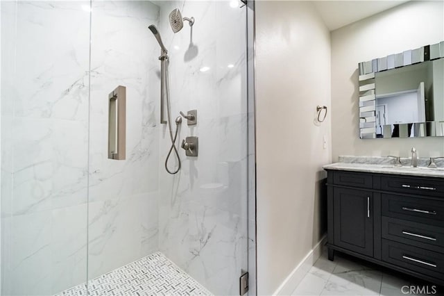 bathroom featuring vanity and a shower with door