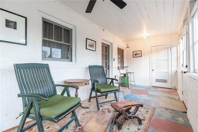 sunroom / solarium with ceiling fan