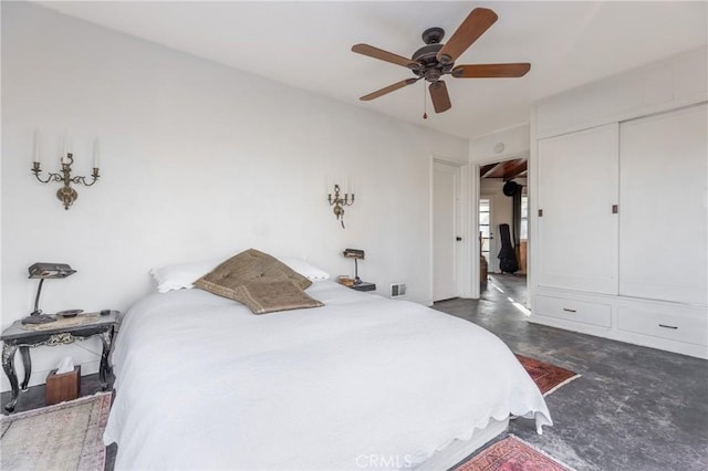 bedroom with ceiling fan and a closet