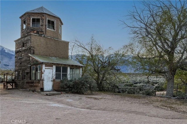 exterior space featuring a mountain view