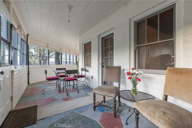 sunroom / solarium with vaulted ceiling