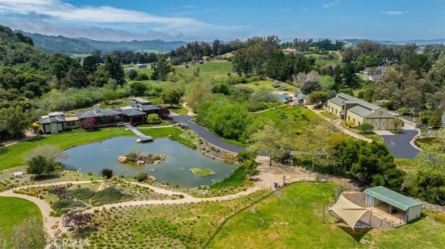 birds eye view of property with a water view