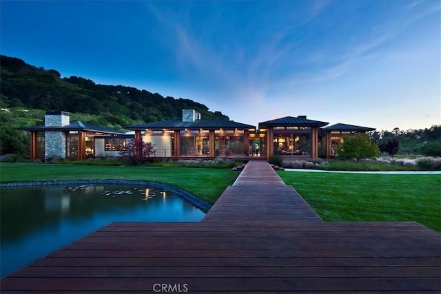 dock area with a gazebo and a lawn