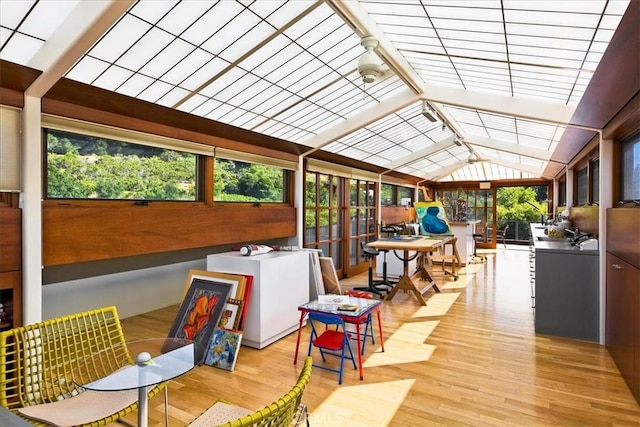 sunroom featuring vaulted ceiling