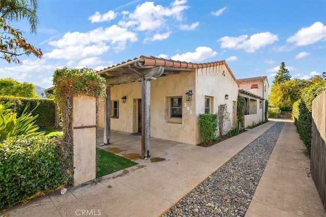 view of property exterior featuring a patio area