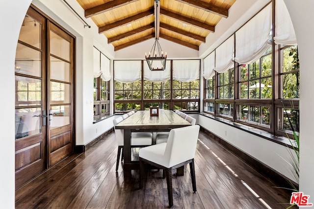 sunroom / solarium with wooden ceiling, vaulted ceiling with beams, and an inviting chandelier