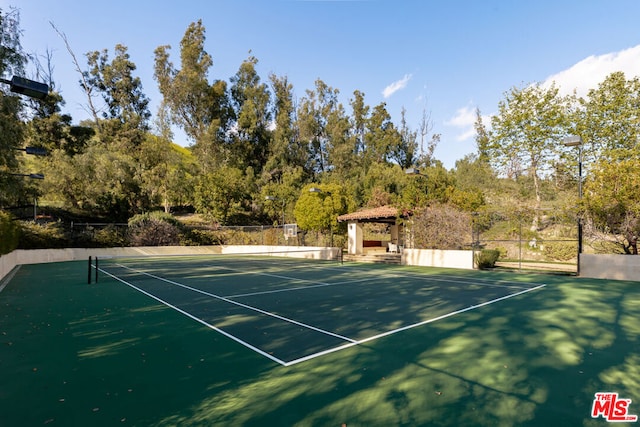 view of sport court with a gazebo