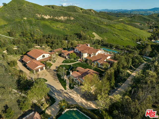 drone / aerial view featuring a mountain view