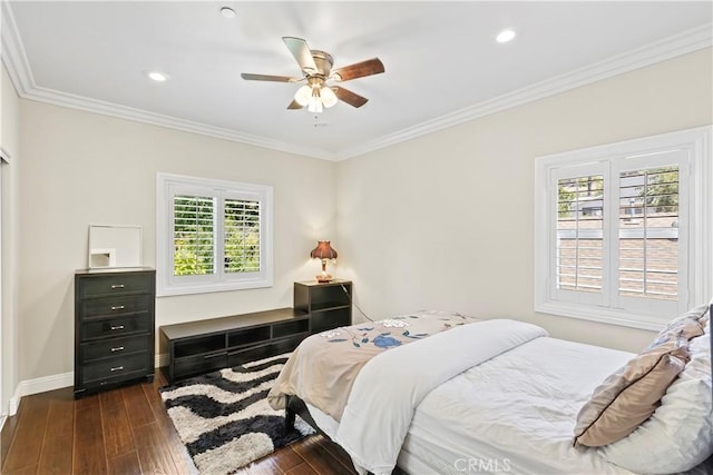 bedroom with dark hardwood / wood-style floors, ceiling fan, and ornamental molding