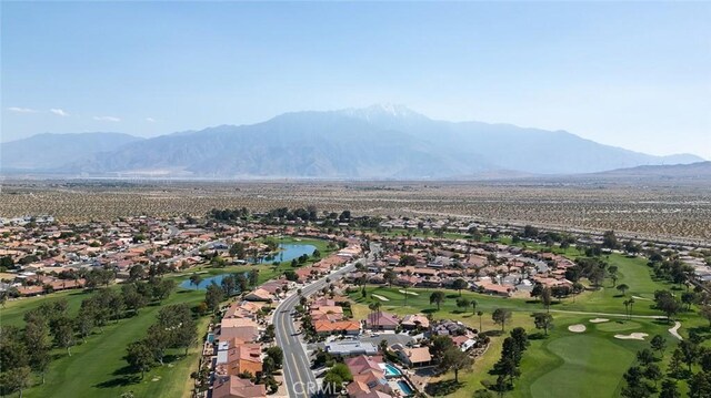 bird's eye view with a water and mountain view