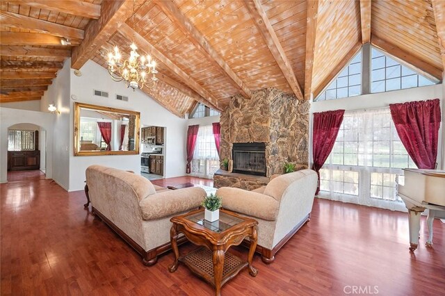 living room featuring beamed ceiling, high vaulted ceiling, and hardwood / wood-style flooring