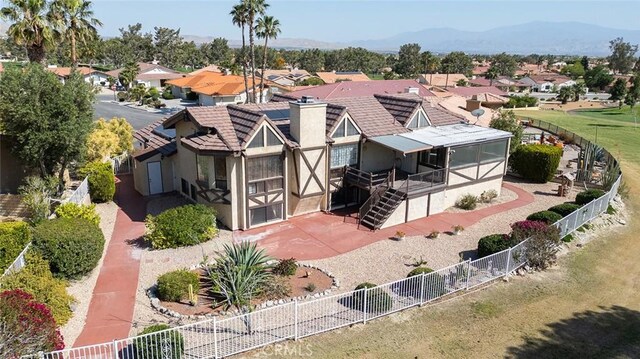 birds eye view of property featuring a mountain view