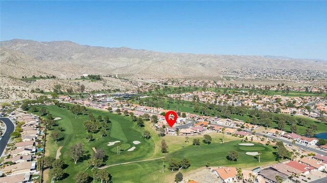 birds eye view of property with a mountain view