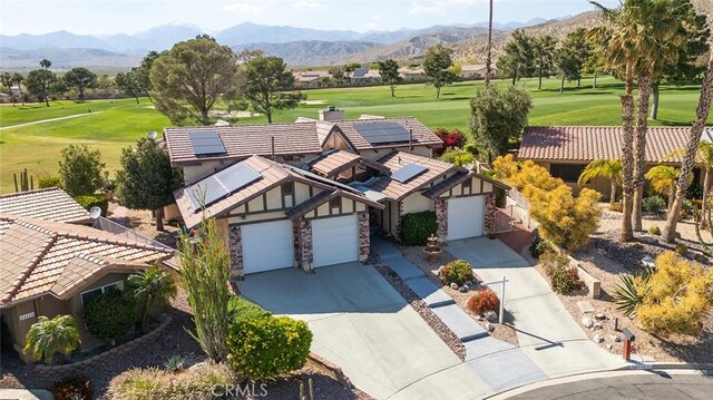 birds eye view of property featuring a mountain view