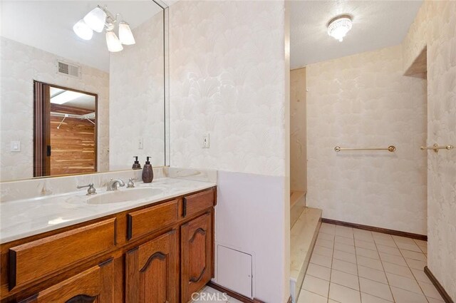 bathroom featuring tile patterned floors and vanity