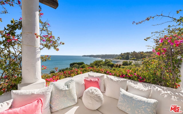 view of terrace with a water view