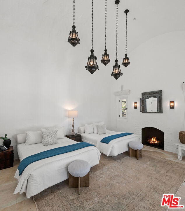 bedroom featuring high vaulted ceiling