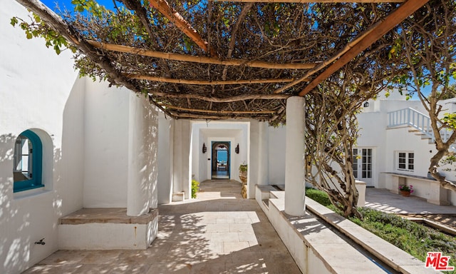 doorway to property featuring a patio