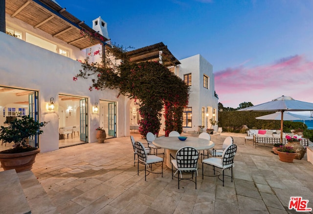 view of patio terrace at dusk