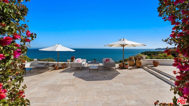 view of patio / terrace with a water view