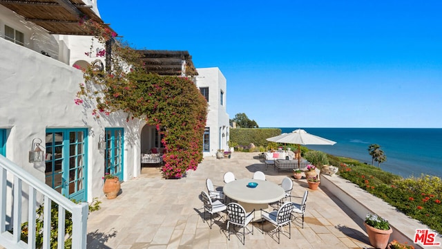 view of patio featuring a water view