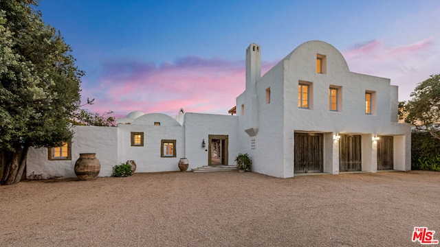 view of adobe home